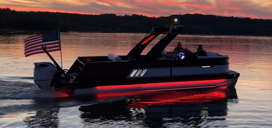 Viaggio pontoon boat docked at sunset