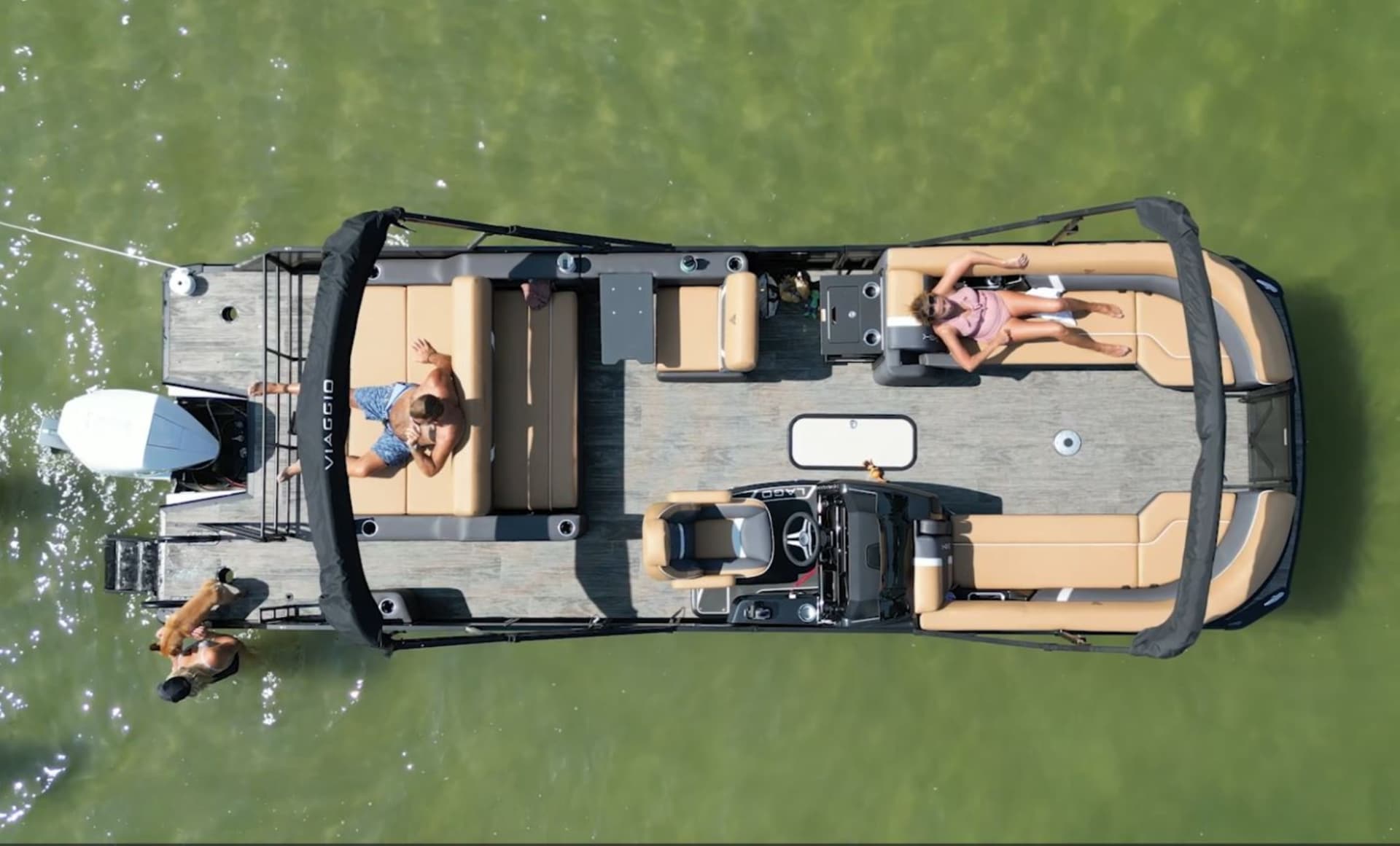 Family enjoying a pontoon boat on the lake